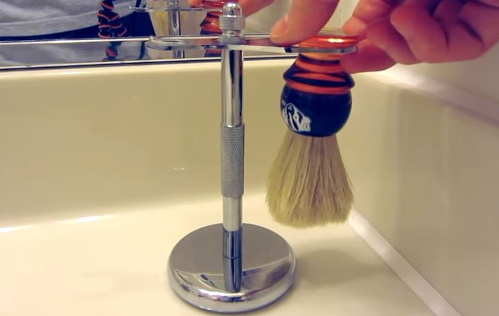Putting the brush into the decent shaving brush stands