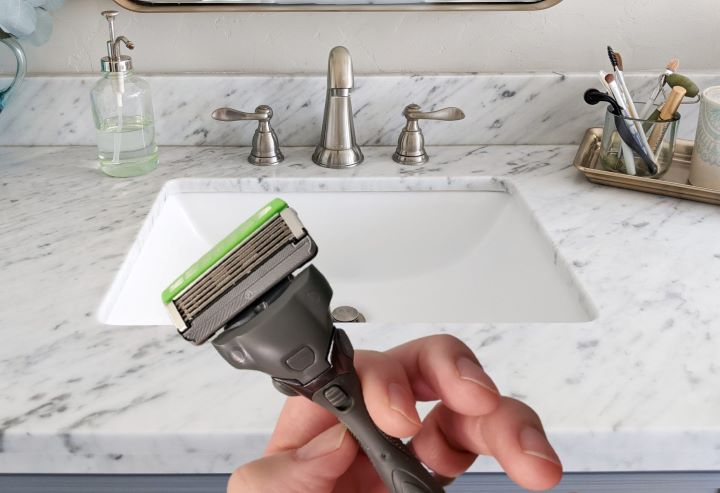 Confirming how the Schick razor's handle absorbs shock to reduce nicks, cuts, and irritation